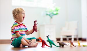 a child playing with dinosaurs