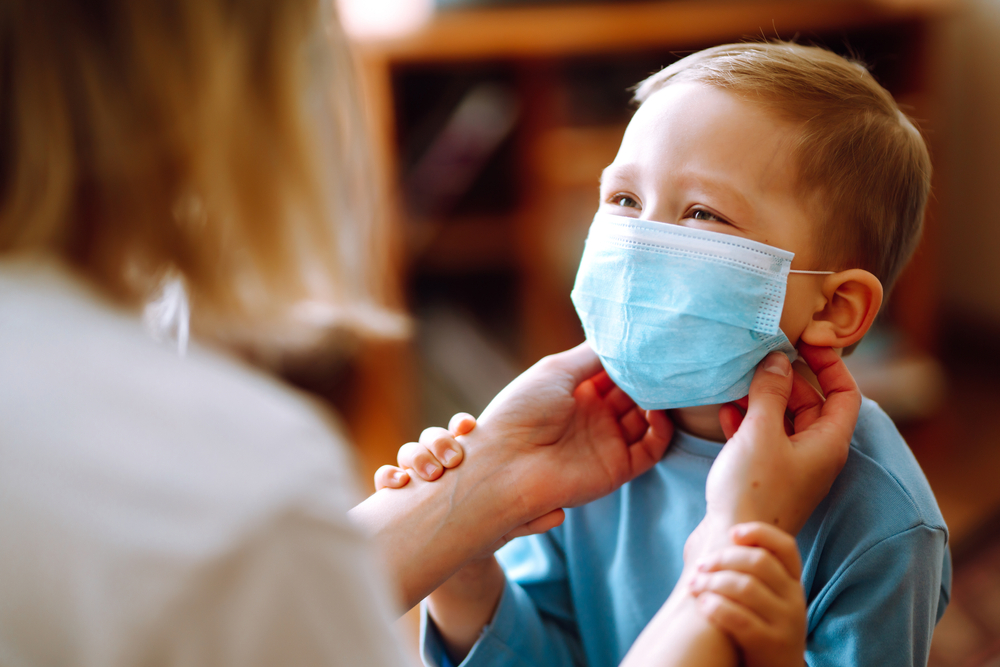 child with face mask