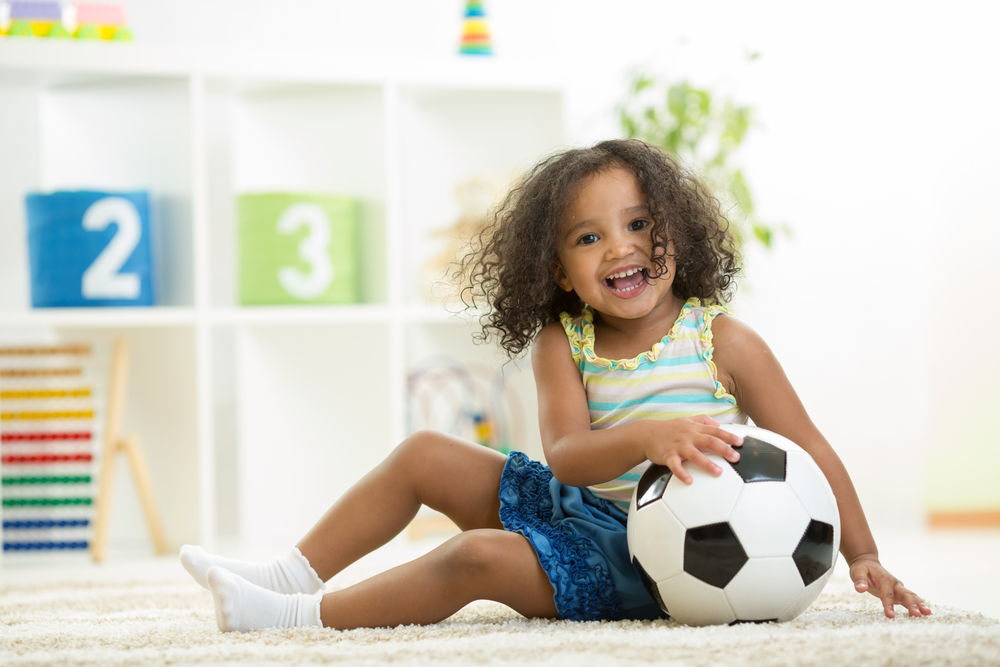 toddler with soccer ball