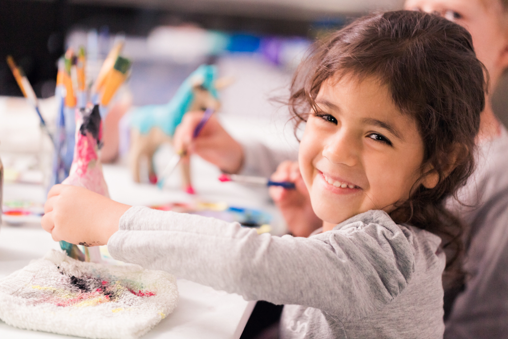 three year old girl doing an art project