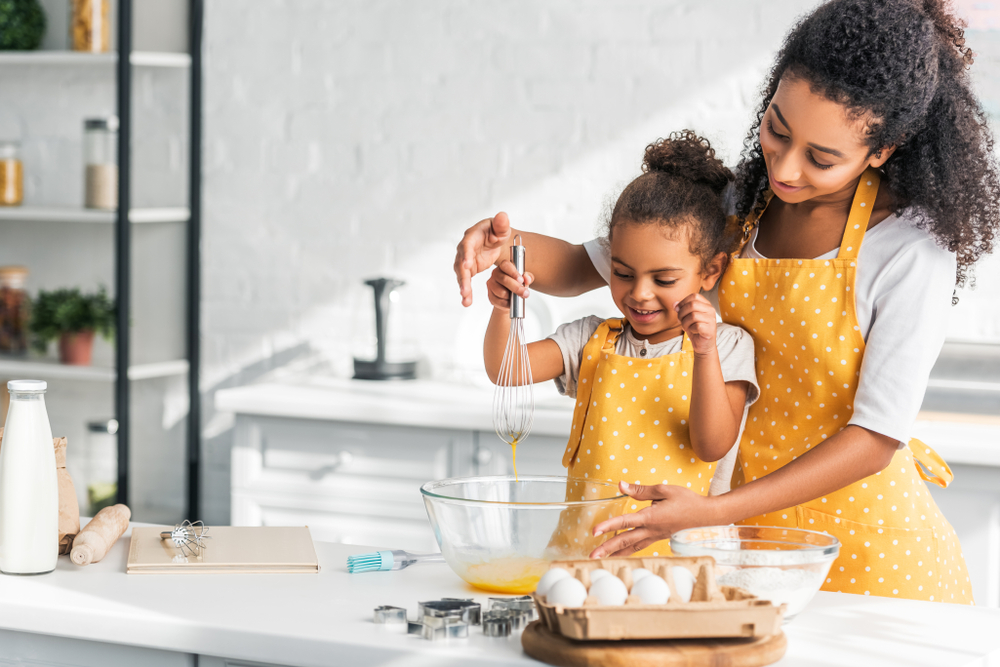 mom and daughter cooking