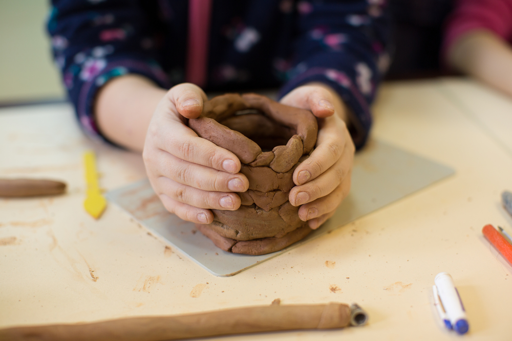 a child working with clay